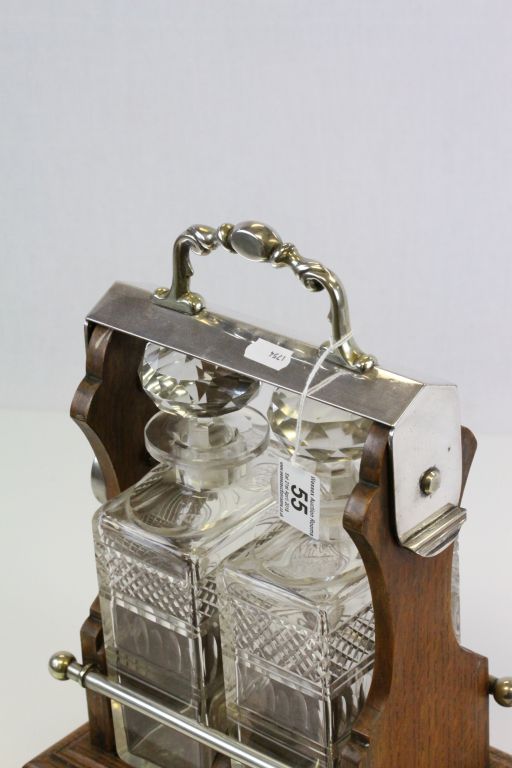 Oak & Silver plated two bottle Tantalus with original cut glass Decanters - Image 2 of 2