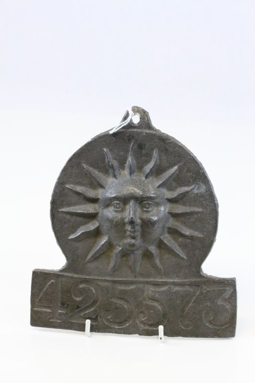 Lead Fire Plaque with Sun design and numbered 425573