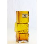 An amber glass vase in the style of Whitefriars Drunken Bricklayer