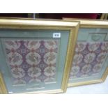 Pair of framed and glazed oriental silk panels with jade pendant