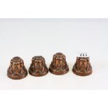 Four vintage miniature Copper Jelly moulds