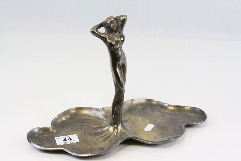 Art Nouveau style metal tray with female figure to centre