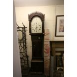 19th century Mahogany Longcase Clock with carved domed hood, the white enamel face with strike/