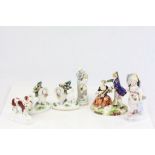 Group of mixed ceramics to include a pair of Poodles with baskets in their mouths, a couple with