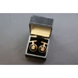 Pair of enamelled silver gilt circular cufflinks, with applied crown to centre