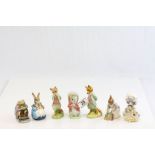 Four Royal Albert Beatrix Potter figurines to include; Mrs Rabbit & Bunnies, Hunca Munca