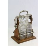 Oak & Silver plated two bottle Tantalus with original cut glass Decanters