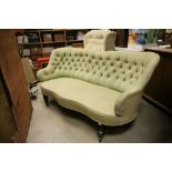 19th century Salon Settee / Sofa with Button Back and raised on bulbous legs and castors