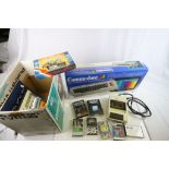 Boxed Commodore 64 gaming console plus a quantity fo cassette games and accessories