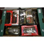 Five boxed 1/24 scale Burago cars comprising Bugatti, Jaguar XX, Ford AC Cobra, Mercedes-Benz SSK,