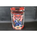 Boxed Hasbro Transformers Optimus Prime figure in unrelated packaging with damage to one foot figure
