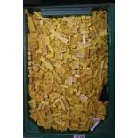 Large tub of yellow Lego bricks