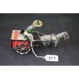 Early 20th C Lehmann Dare Devil clockwork tinplate toy of a zebra pulling a man on cart marked