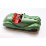 Original Schuco Examico 4001 clockwork tin plate vehicle in green with red seat, with key, gear