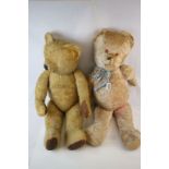 Two large vintage straw filled bears, both looking a little worn with one missing eyes, both