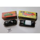 Two boxed Schuco Micro Racer clockwork diecast model vehicles to include 1046 VW in black and