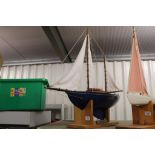 Scratch built sail boat in good condition on wooden plinth, approx length 35 inches
