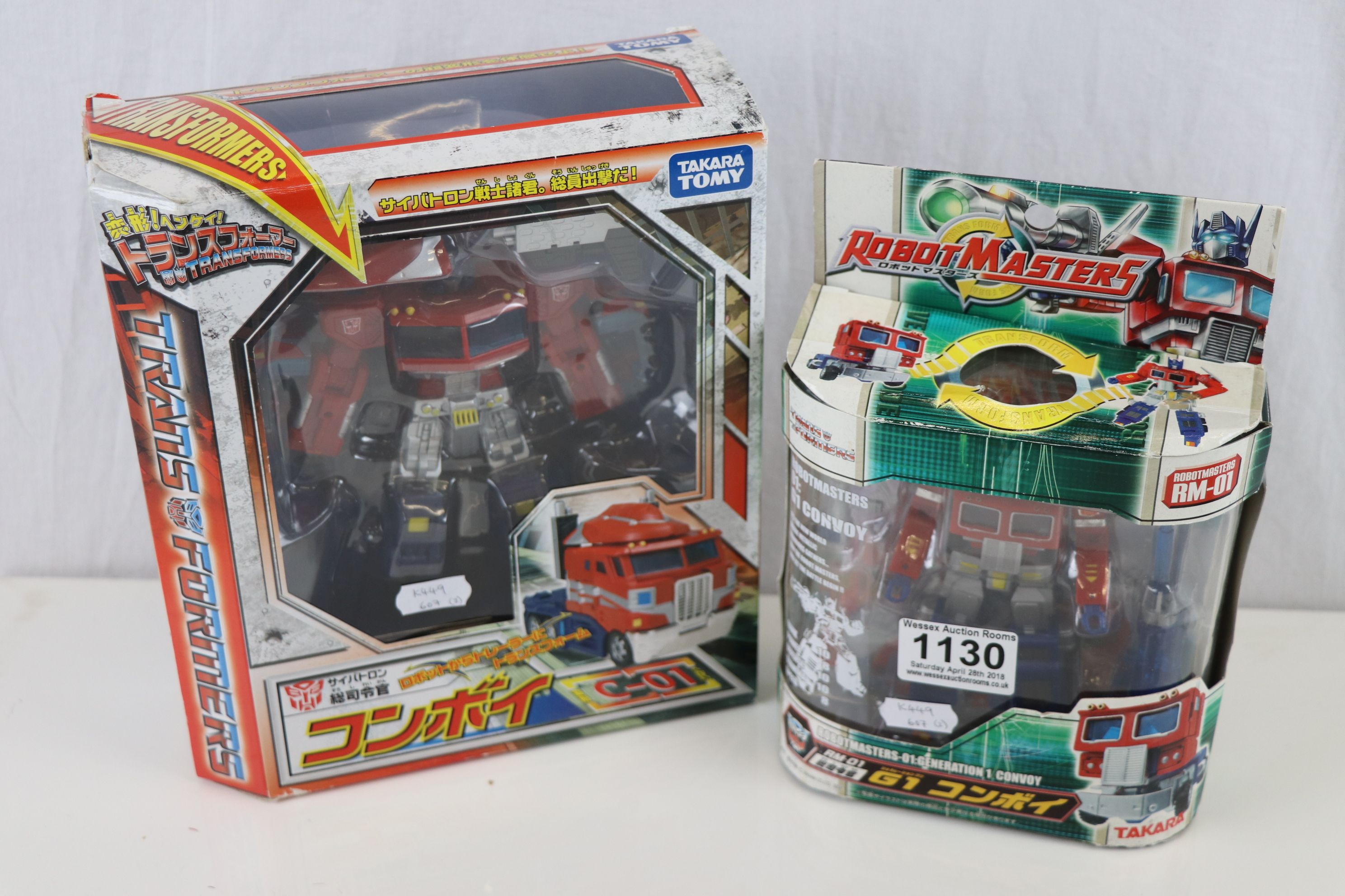 Two boxed Takara Japanese Transformers Optimus Prime figures to include C-01 and Robot Masters 01