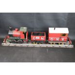 Scratch built 0 gauge locomotive with tender, made from wood and diecast with rolling stock on