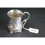 Victorian silver mug, repousse floral and foliate scroll decoration, scroll handle, initials