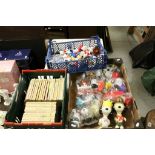 Collection of vintage Snoopy figures and Charlie Brown books