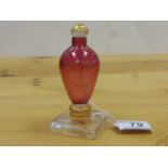 Iestyn Davies studio glass perfume bottle, the cranberry glass body of inverse baluster form,