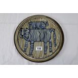 Brian Newman (b. 1935) glazed studio pottery charger depicting stylised tigers in blue with olive