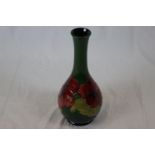 Moorcroft large Hibiscus pattern vase of baluster form, green ground with red hibiscus flower