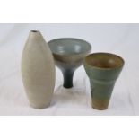 Three unsigned studio pottery vases, one of mottled beige ringed tapered form, height
