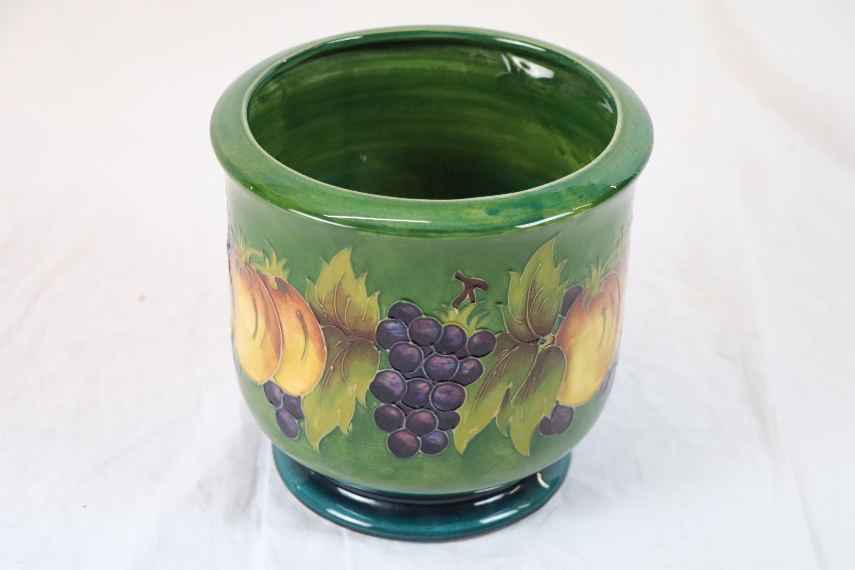 Moorcroft Fruit and Vine pattern limited edition jardiniere, green ground with apple and grape