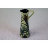 Moorcroft tall jug of slender form, bullrush and lily pattern, impressed and printed marks to