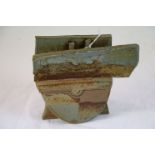 Studio pottery two piece ornament depicting a steam boat at sea, blue, green and brown unglazed