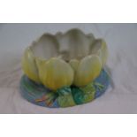 Clarice Cliff for Newport Pottery Water Lily bowl modelled as a yellow water lily raised on blue and