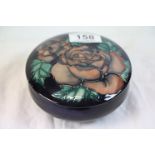 Moorcroft bowl bowl with cover, dark blue ground with brown rose decoration, impressed marks to