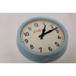 Cath Kidston Circular Wall Clock together with a Pale Blue Painted Hanging Wall Cabinet with