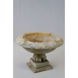 A carved marble footed bowl.