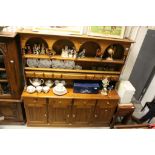 Large Pine Dresser, the upper section with Arched Shelf above a Galleried Shelf with Spice Drawers