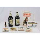 Six framed & glazed Guinness advertising images plus Commemorative unopened Beers, advertising jug