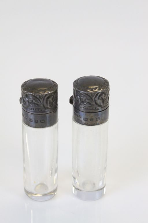 Pair of silver topped glass scent bottles with original glass stoppers, makers Sanders & Aquilar,