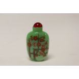 A green opaline glass Chinese perfume bottle.