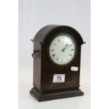 Mahogany key wind Mantle clock with enamel dial, the movement marked with a lion symbol