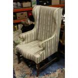 Early 20th century Wingback Armchair on Square Tapering Legs and Brass Castors