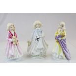Three Royal Doulton NSPCC ceramic figurines with certificates, models Faith, Hope & Charity