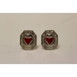 A pair of silver and enamel heart shaped paneled cuff links.