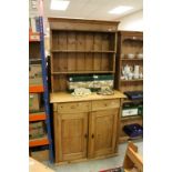 19th century Pine Dresser, the back with two shelves above two drawers and two cupboards