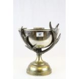 Large White Metal Punch Bowl held by Metal Antlers on a Brass Pedestal Base