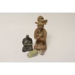Mexican seated pottery figures with marks to base together with another seated figure and two glazed