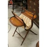 19th century Mahogany Folding Sewing Table with Central Basket on slender turned supports