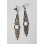 A pair of silver and marcasite art deco style earrings with opal panel.