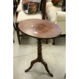 Georgian Mahogany Tilt Top Table with Oval Top and raised on turned bobbin support and three legs
